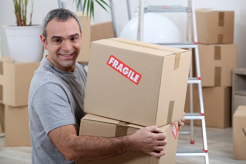 Removal van team loading furniture safely in Tooting