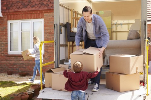 Commercial relocation process with labelled boxes and office equipment in Tooting