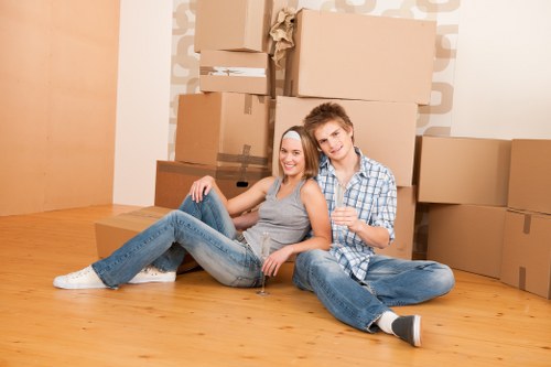 Furniture removals team handling items on a residential street in Tooting