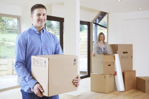 Moving crew handling office equipment during a Tooting commercial move