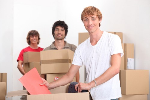 Local team handling office furniture and equipment during a move in Tooting