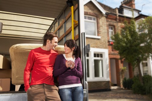 Local team collecting a sofa and household furniture in Tooting