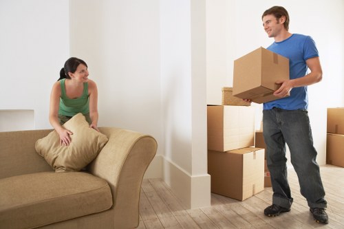 Packed moving boxes and furniture ready for flat removals in Tooting